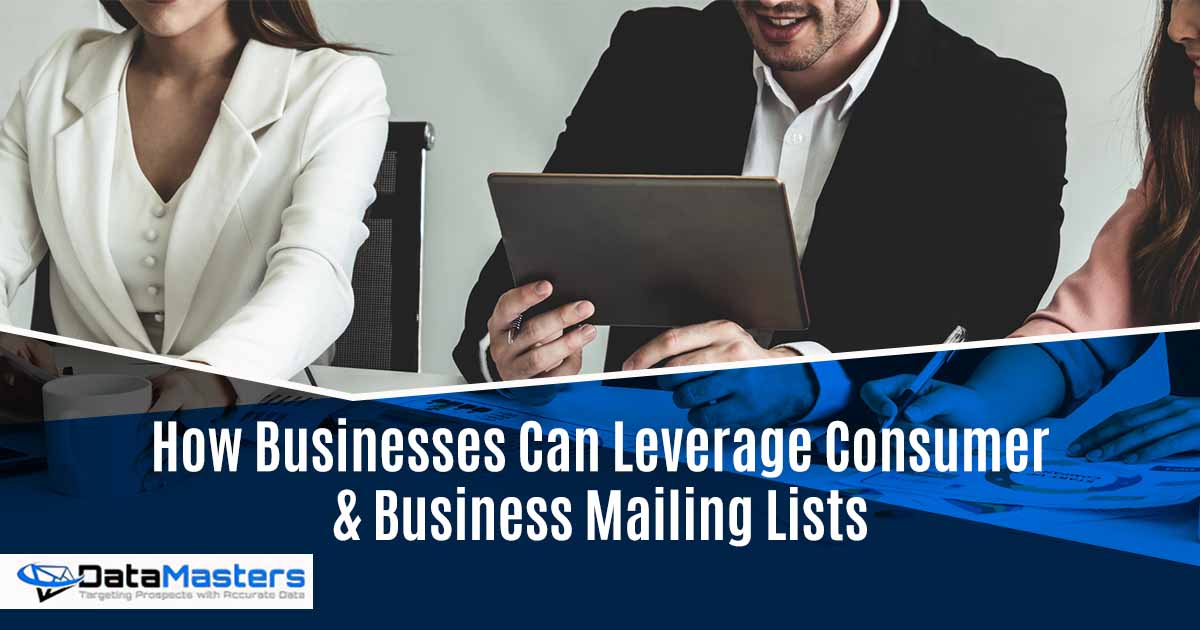 Businessman and businesswomen working in office, featuring DataMasters and highlighting How Businesses Can Leverage Consumer & Business Mailing Lists, ensuring it aligns with the page's context.