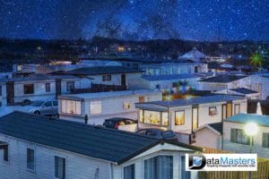 Blue back ground image with image on the right showing a large number of mobile homes in area.