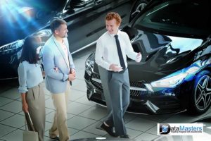 Image showing a couple talking to a car salesman in a show room