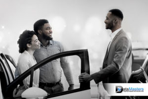 Image showing a couple talking to a car salesman in a show room