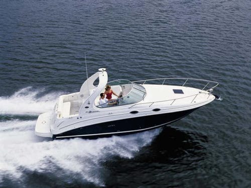 A boat owner cuts across a waterway on a beautiful sunny day. DataMasters helps businesses reach boat owners like this using their boat owner database.