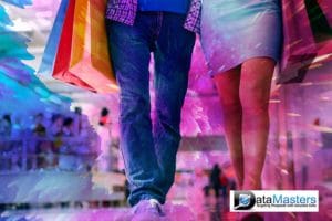 Young woman and young man smiling on a multicolor background