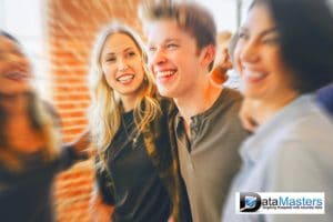 Image with male and female young adults smiling