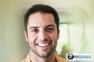 Image of a young hispanic male smiling and looking forward