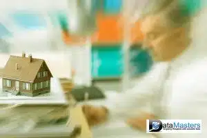 Image of house shown on the left and a man in white dress shirt and tie on the right.