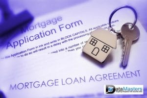 Mortgage documents and keys for house laying on top.