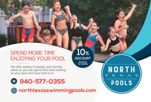 A group of excited children hold hands to jump into a swimming pool.