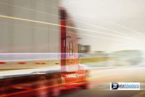 Image of semi truck and trailer moving fast on the road